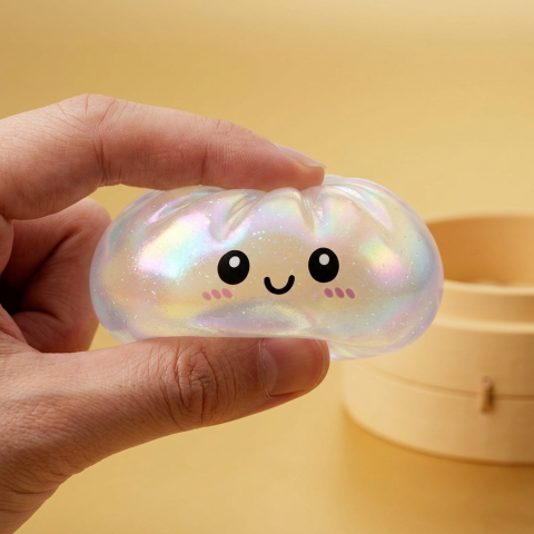 Dumpling Squishy Holographique Regenbogenschimmer — slow-rise Effekt, der Schaum federt langsam zurück