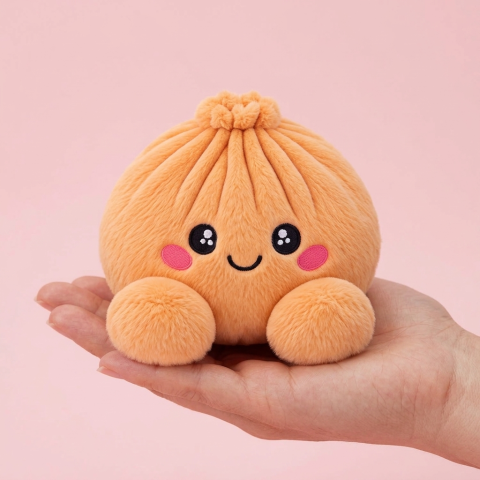 Squishy Dumpling Orange Plüschtier in der Hand gehalten, echte Größe