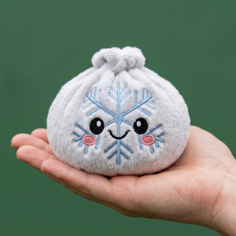 Dumpling Squishy Schneeflocke Winter in der Hand gehalten, echte Größe