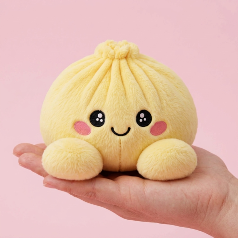 Dumpling Squishy Zitronengelb in der Hand gehalten, echte Größe